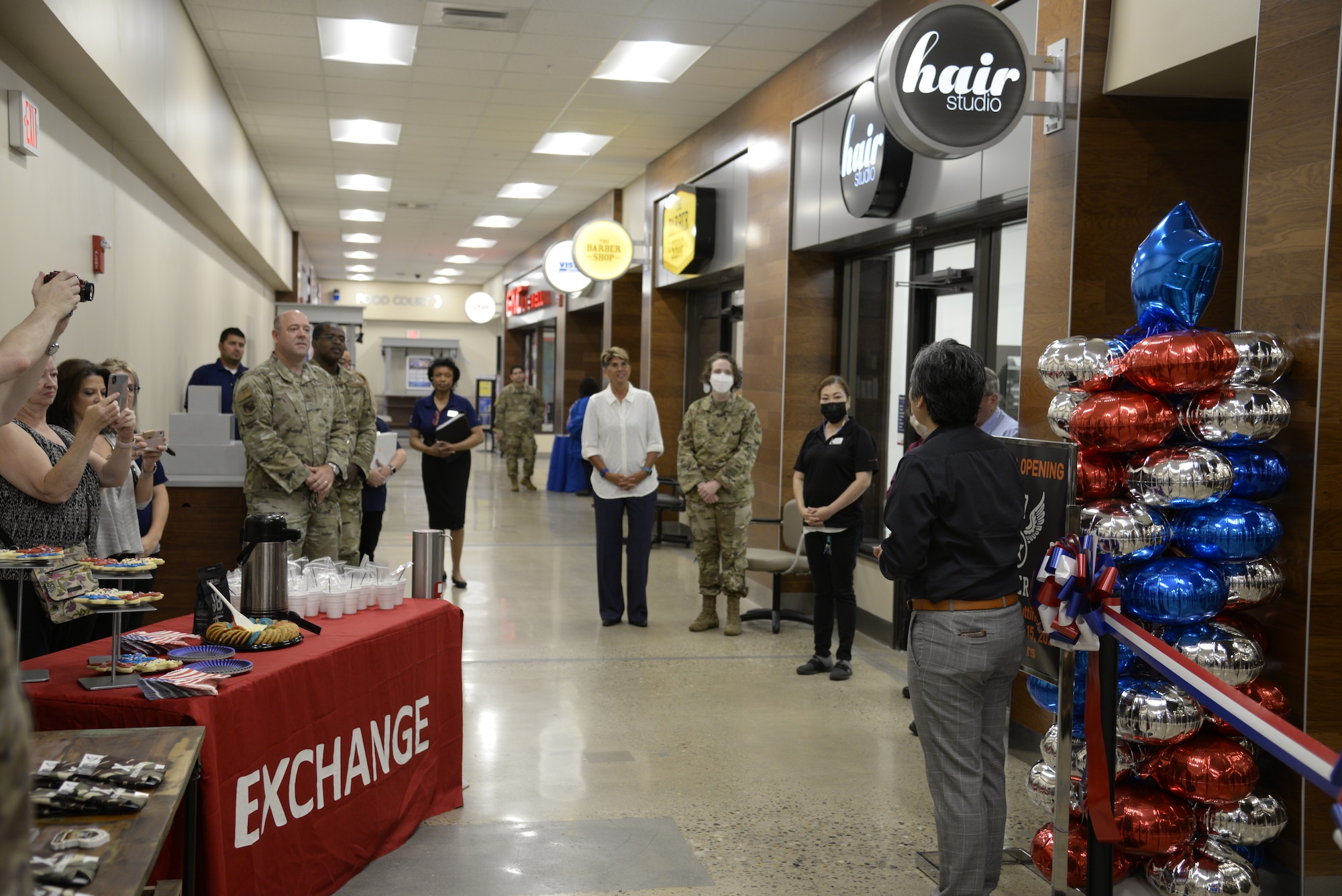 Installation leaders join Army & Air Force Exchange Service managers during the opening of Bunker 27 at Wright-Patterson Air Force Base on July 15. A ribbon-cutting ceremony marked the new store’s opening at the Base Exchange. (U.S. Air Force photo by Airman 1st Class Jack Gardner)