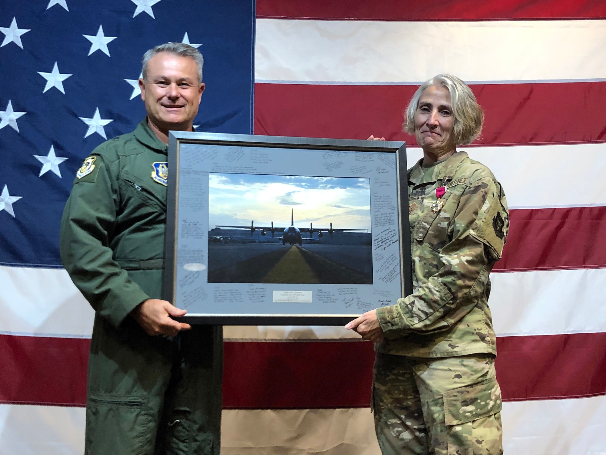 Brig. Gen. Craig McPike, 94th Airflit Wing commander, recognizes Chief Master Sgt. Vicki Robertson, 94th Airlift Wing Command Chief, for outstanding service to the wing at her going away event, Dobbins Air Reserve Base, Georgia, July 22, 2022.