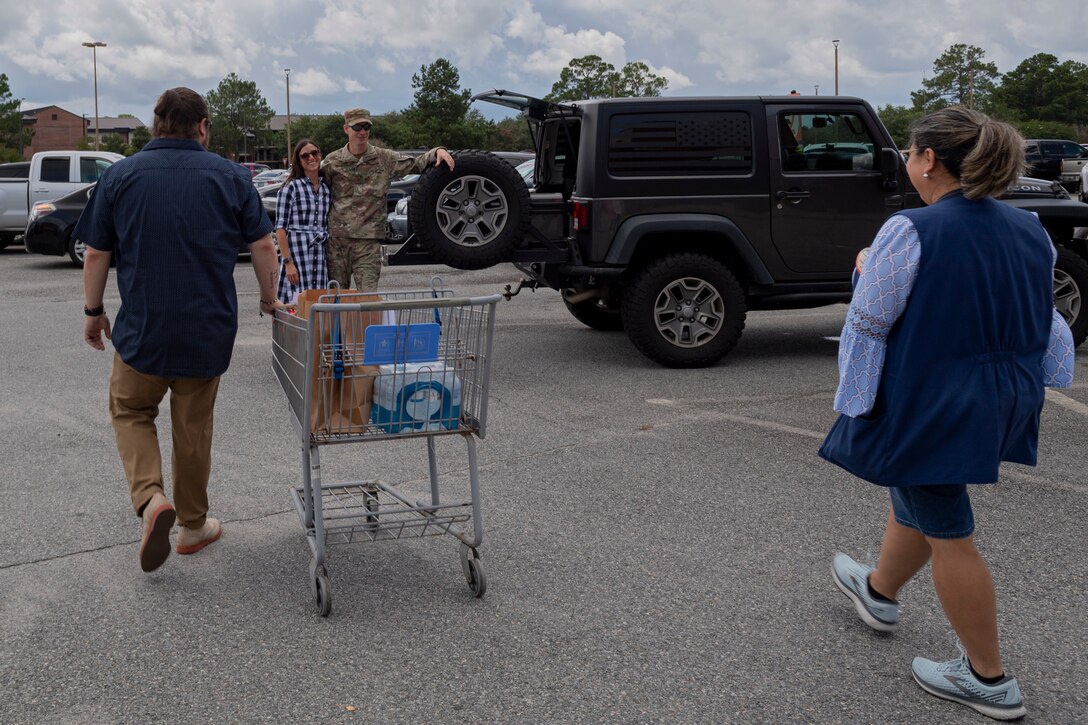 Photo of Defense Commissary Agency employees completing a Click2Go order
