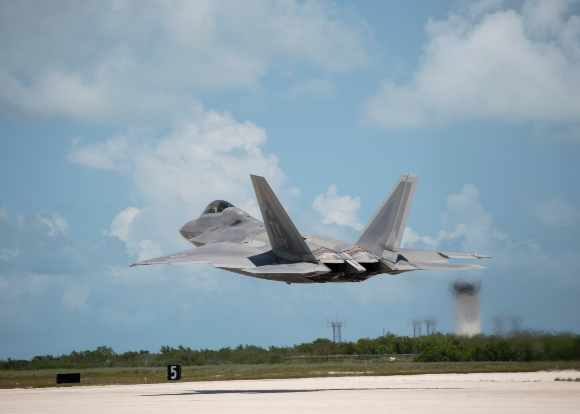 A fighter jet takes off