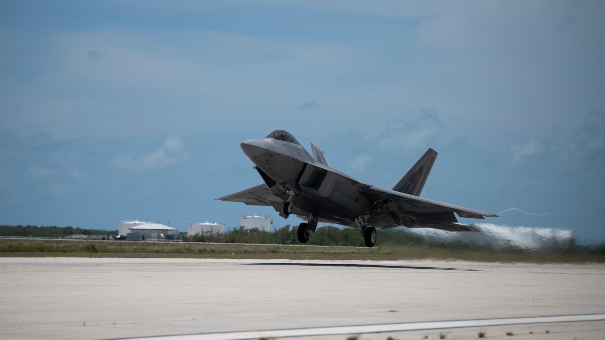 A fighter jet takes off