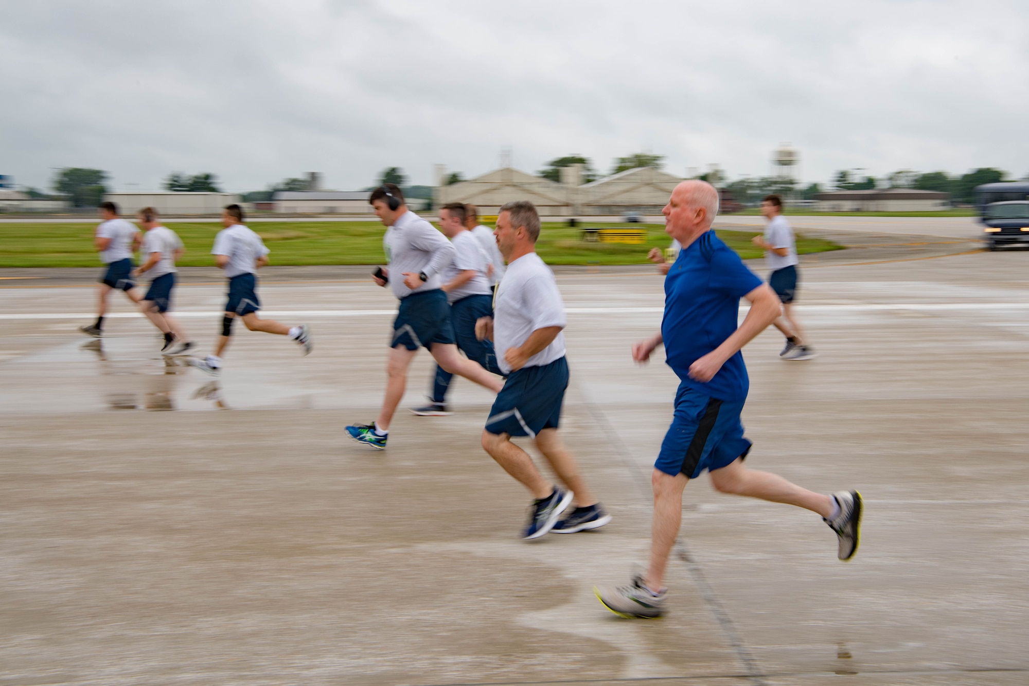Col. Thom Pemberton, 434th Air Refueling Wing commander, runs with Grissom Airmen during the physical fitness assessment at Grissom Air Reserve Base, Indiana, July 11, 2021. Grissom began fitness testing for the first time in 15 months since the COVID-19 pandemic. (U.S. Air Force photo by Staff Sgt. Jeremy Blocker)