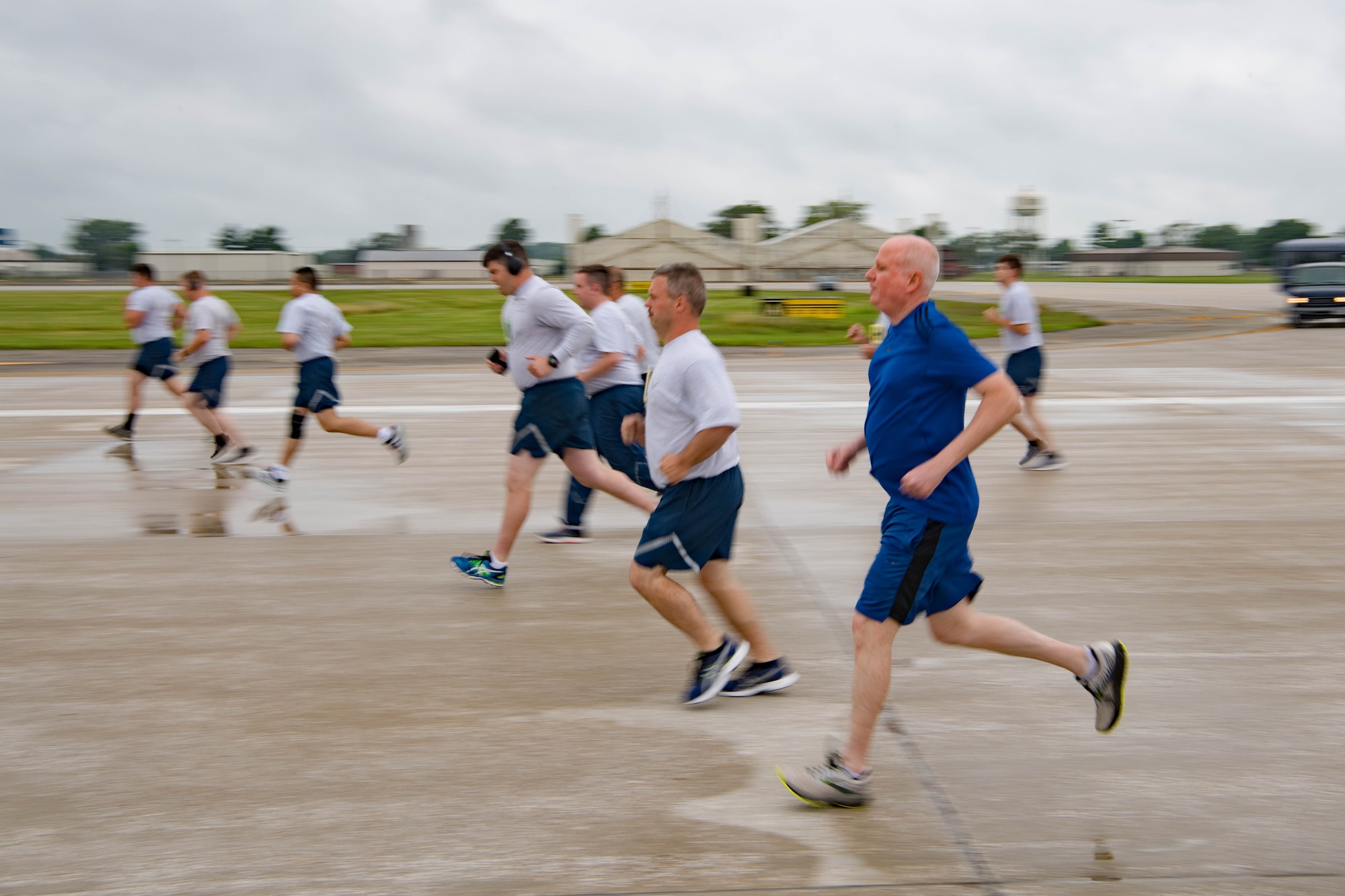 Col. Thom Pemberton, 434th Air Refueling Wing commander, runs with Grissom Airmen during the physical fitness assessment at Grissom Air Reserve Base, Indiana, July 11, 2021. Grissom began fitness testing for the first time in 15 months since the COVID-19 pandemic. (U.S. Air Force photo by Staff Sgt. Jeremy Blocker)