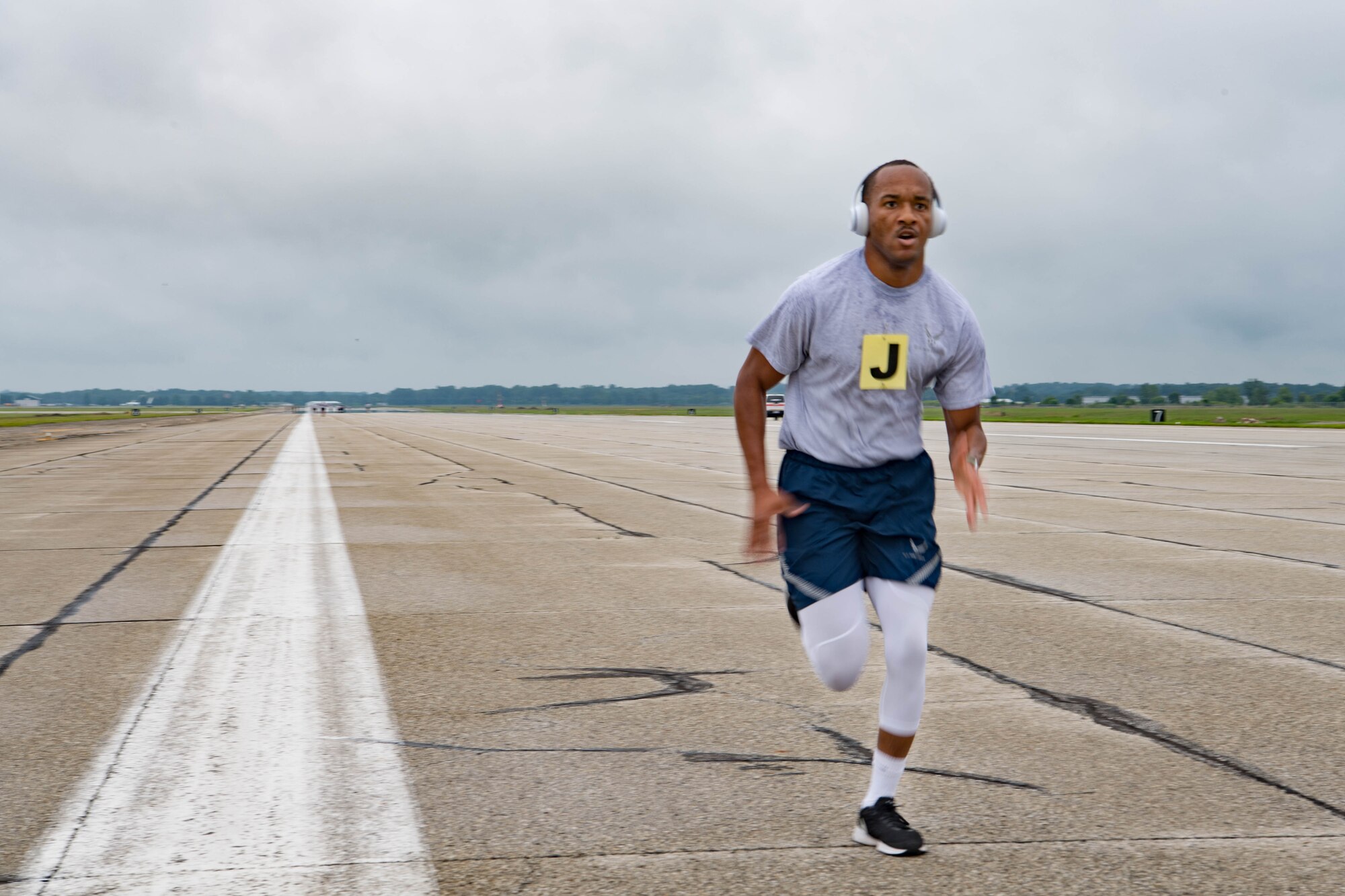 Senior Airman Christopher Simpson, 434th Force Support Squadron personnelist, runs on the flightline at Grissom Air Reserve Base, Indiana, July 11, 2021. Grissom began fitness assessments this month for the first time since the COVID-19 pandemic. (U.S. Air Force photo by Staff Sgt. Jeremy Blocker)
