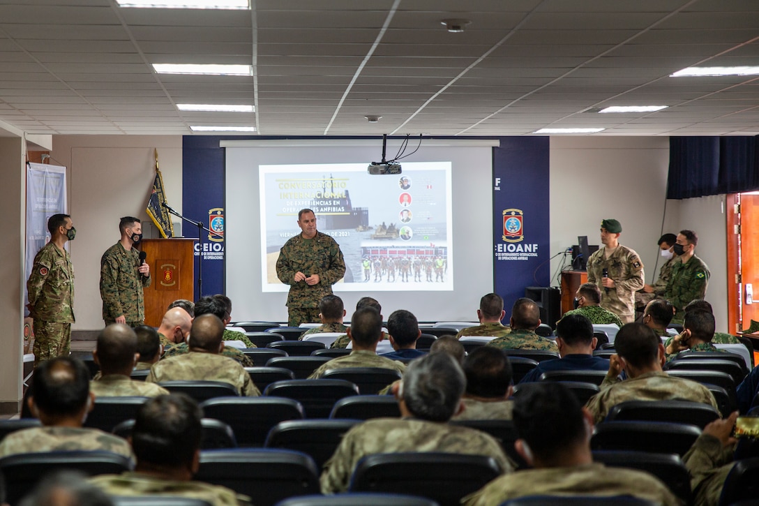 U.S. Marine Corps Col. Brian Ecarius, the senior representative from U.S. Marine Corps Forces, South, addresses a group of U.S. and partner nation Marines and Sailors during a question and answer portion of a multinational amphibious planning conference to highlight the significance of integration and interoperability with partner nations in Ancon, Peru, July 16, 2021. Amphibious partners from Peru, Argentina, Brazil, Chile, Colombia, Ecuador, Mexico, Uruguay, and the United States gathered at the newly established International Amphibious Training Center to share experiences, tactics, and lessons learned related to amphibious operations.
