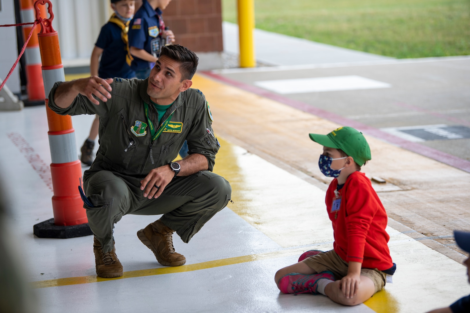 U.S. Air Force Capt. Roberto Mercado, a pilot assigned to the 134th Fighter Squadron, 158th Fighter Wing, answers a question during a group tour of the Vermont Air National Guard base, South Burlington, Vt., June 18, 2021. The tour showcased a cross-section of base missions including the fire department, explosive ordnance disposal, munitions, security forces, and an interactive discussion with a pilot near an F-35. (U.S. Air Force photo by Tech. Sgt. Richard D. Mekkri)