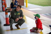 U.S. Air Force Capt. Roberto Mercado, a pilot assigned to the 134th Fighter Squadron, 158th Fighter Wing, answers a question during a group tour of the Vermont Air National Guard base, South Burlington, Vt., June 18, 2021. The tour showcased a cross-section of base missions including the fire department, explosive ordnance disposal, munitions, security forces, and an interactive discussion with a pilot near an F-35. (U.S. Air Force photo by Tech. Sgt. Richard D. Mekkri)