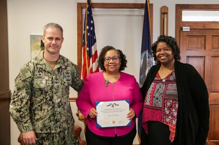 Shari Thomas, the command’s diversity and inclusion program manager, was presented with a DON Civilian Service Achievement Medal virtually on June 16, and in person on July 15. Thomas (middle), shown here with Commanding Officer Capt. Eric Correll (left) and Deputy Director, EEO, Diversity and Inclusion Johnna Robinson (right), received the award recognizing her service as an inaugural member of the NAVSEA Enterprise Inclusion and Engagement Council from October 2018 to October 2020. (U.S. Navy photo by Ashli Jernigan)