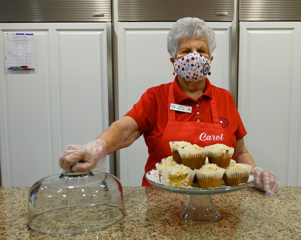 Carol McClure gets set to hand out some of her blueberry muffins July 16 in the Fisher House at Wright-Patterson Air Force Base. McClure was honored as the 2021 Air Force Fisher House Volunteer of the Year. (U.S. Air Force photo by R.J. Oriez)