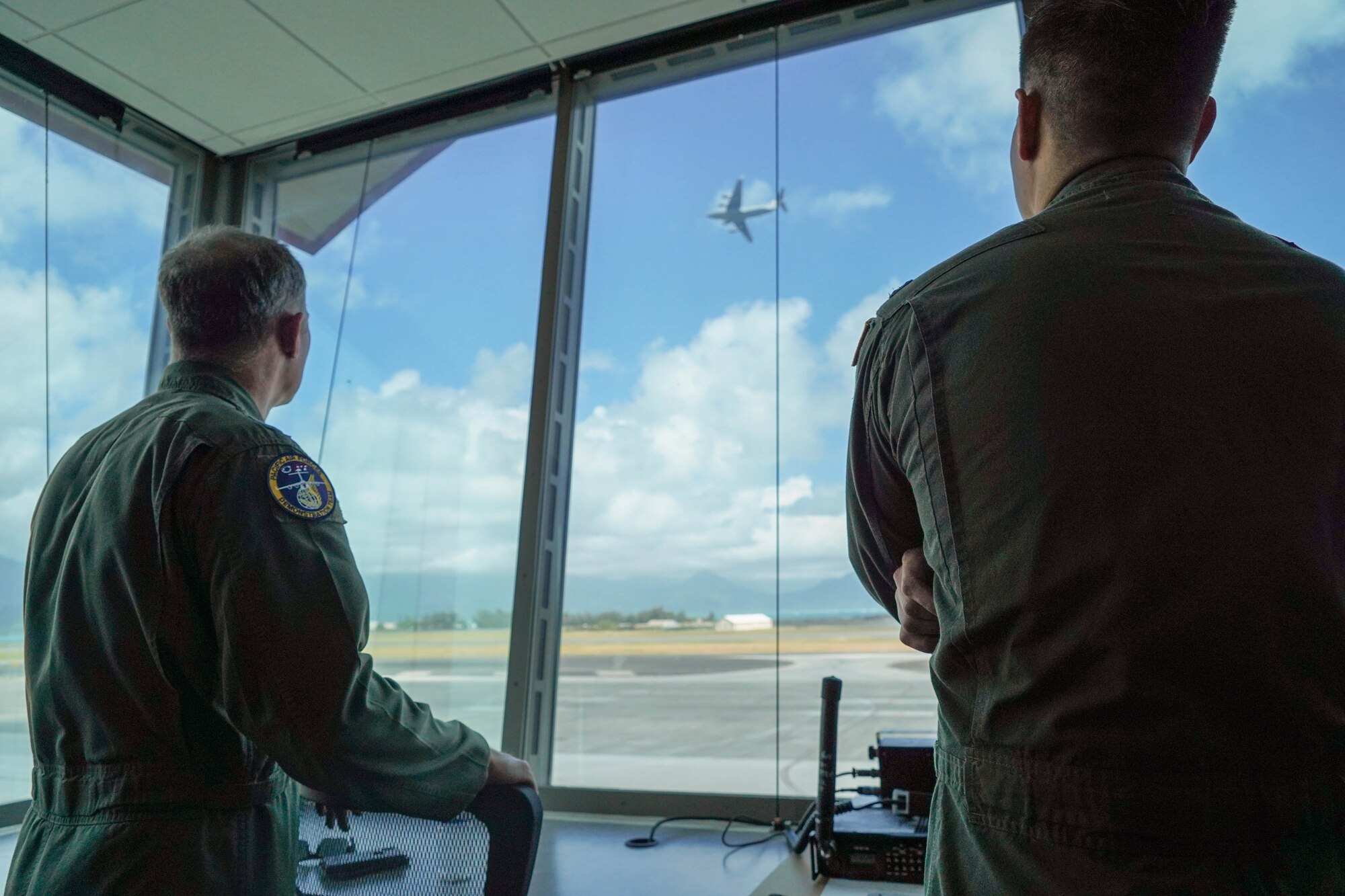 U.S. Air Force Lt. Gen. David A. Krumm, commander of Alaskan North American Aerospace Defense Command Region, Alaskan Command, and Eleventh Air Force, watches the Pacific Air Forces C-17 Demonstration Team conduct training operations at Marine Corps Base Hawaii, during his visit with Airmen assigned to Joint Base Pearl Harbor-Hickam, Hawaii, July 20, 2021.  Krumm visited several squadrons around the 15th Wing to gain an in-depth exposure to their unique mission and how the wing contributes to the Indo-Pacific region’s security and stability. (U.S. Air Force photo by Airman 1st Class Makensie Cooper)