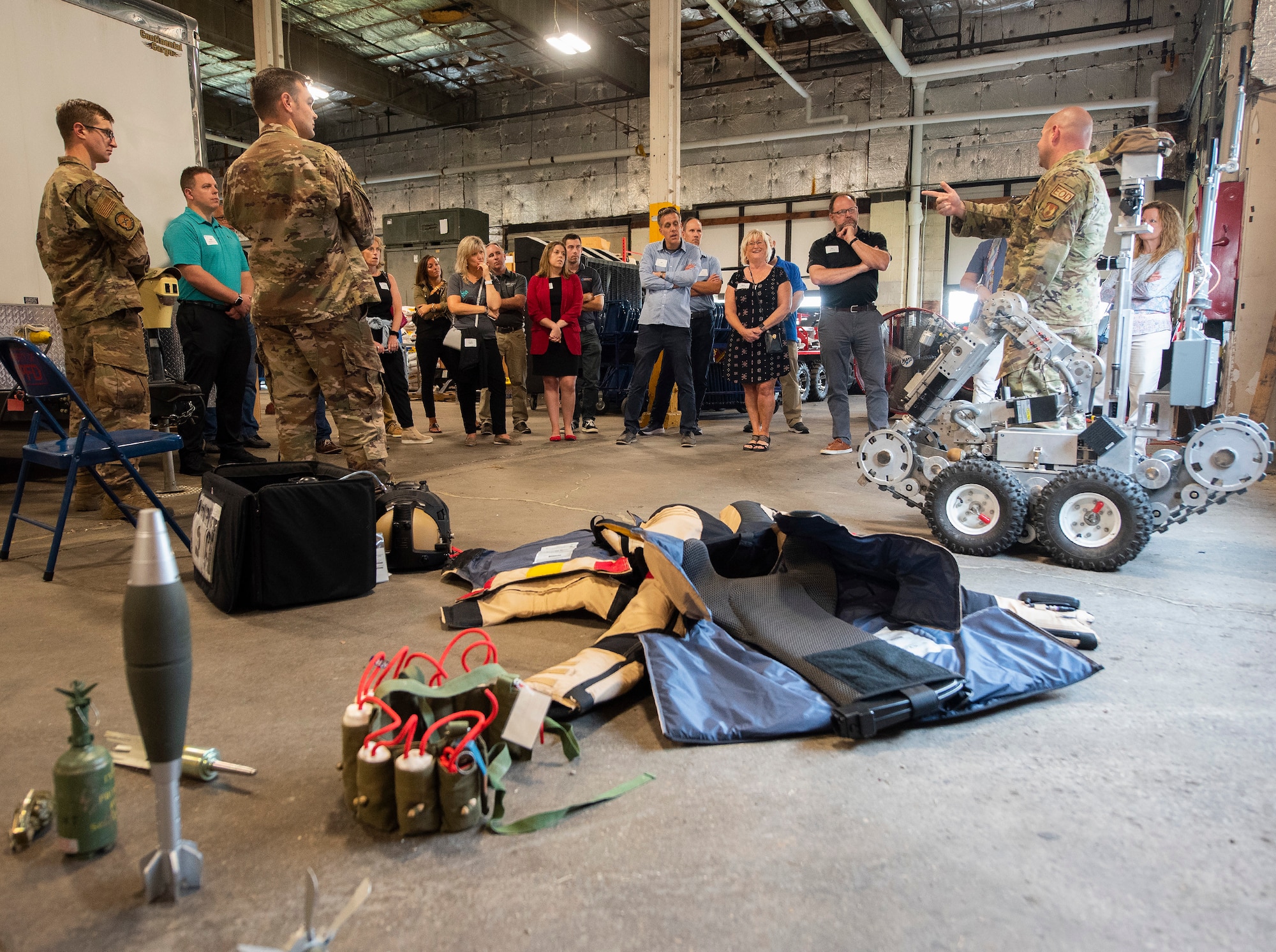 Leadership Dayton program members listen to Staff Sgt. Kile Edwards of the 788th Civil Engineer Squadron’s Explosive Ordnance Disposal Flight explain his unit’s mission, equipment and capabilities July 14 at Wright-Patterson Air Force Base. EOD provides assistance, as needed, to local communities or if military munitions are found in the surrounding area.  (U.S. Air Force photo by R.J. Oriez)