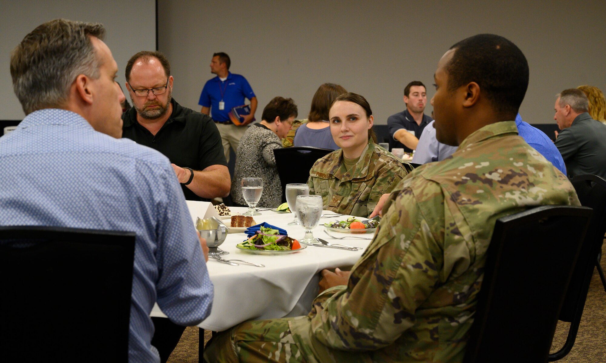 Staff Sgts. Rebecca Proulx and Mario Fosque, both with the 88th Medical Group, have lunch with Leadership Dayton program members July 14 in the Hope Hotel outside Wright-Patterson Air Force Base. The Airmen had recently returned from deployments and shared their experiences with the group. (U.S. Air Force photo by R.J. Oriez)
