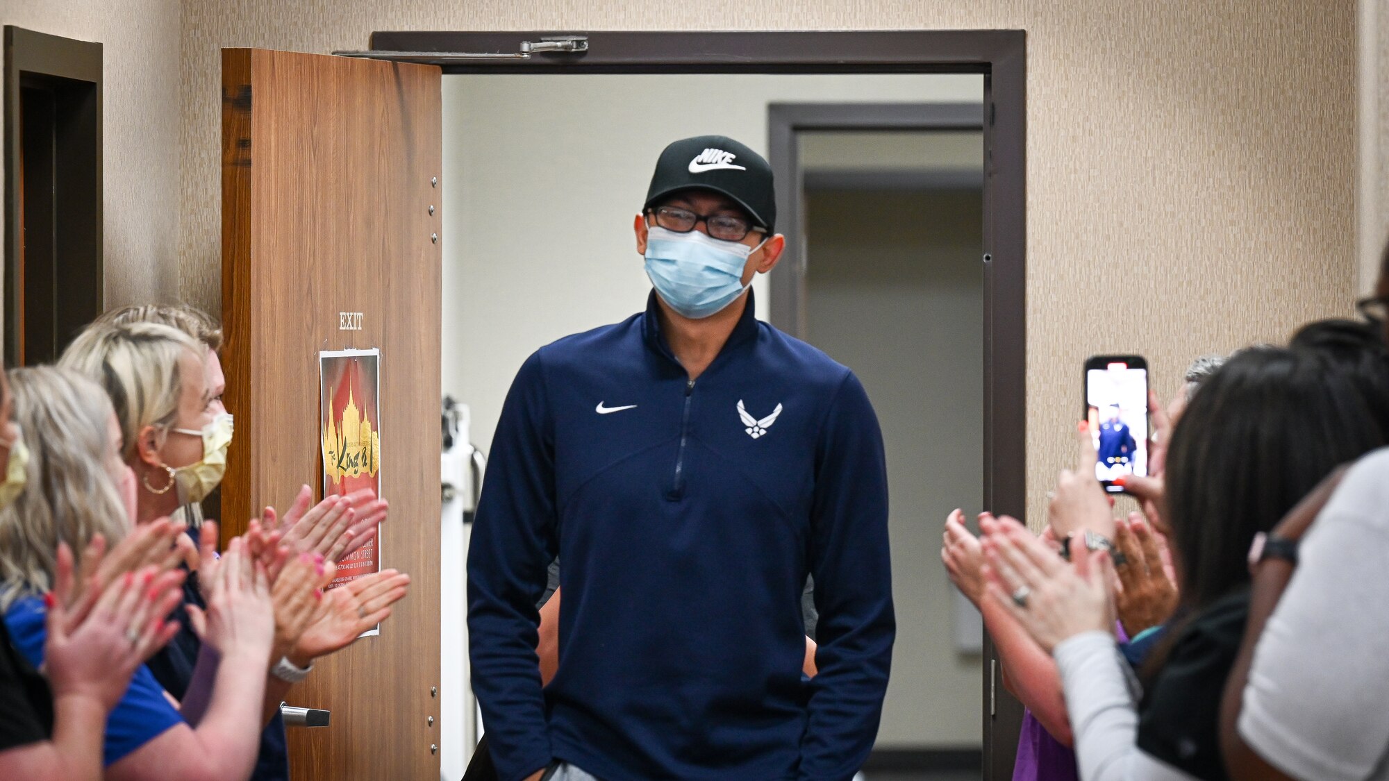 Senior Airman Eleazar Hernandez, 2nd Maintenance Squadron aerospace ground equipment journeyman, is applauded by medical professionals after his final chemotherapy treatment at the CHRISTUS Health Shreveport-Bossier medical center, Louisiana, July 2, 2021. Hernandez had Hodgkin’s lymphoma, a cancer of the lymphatic system and part of the immune system. (U.S. Air Force photo by Airman 1st Class Jonathan E. Ramos)