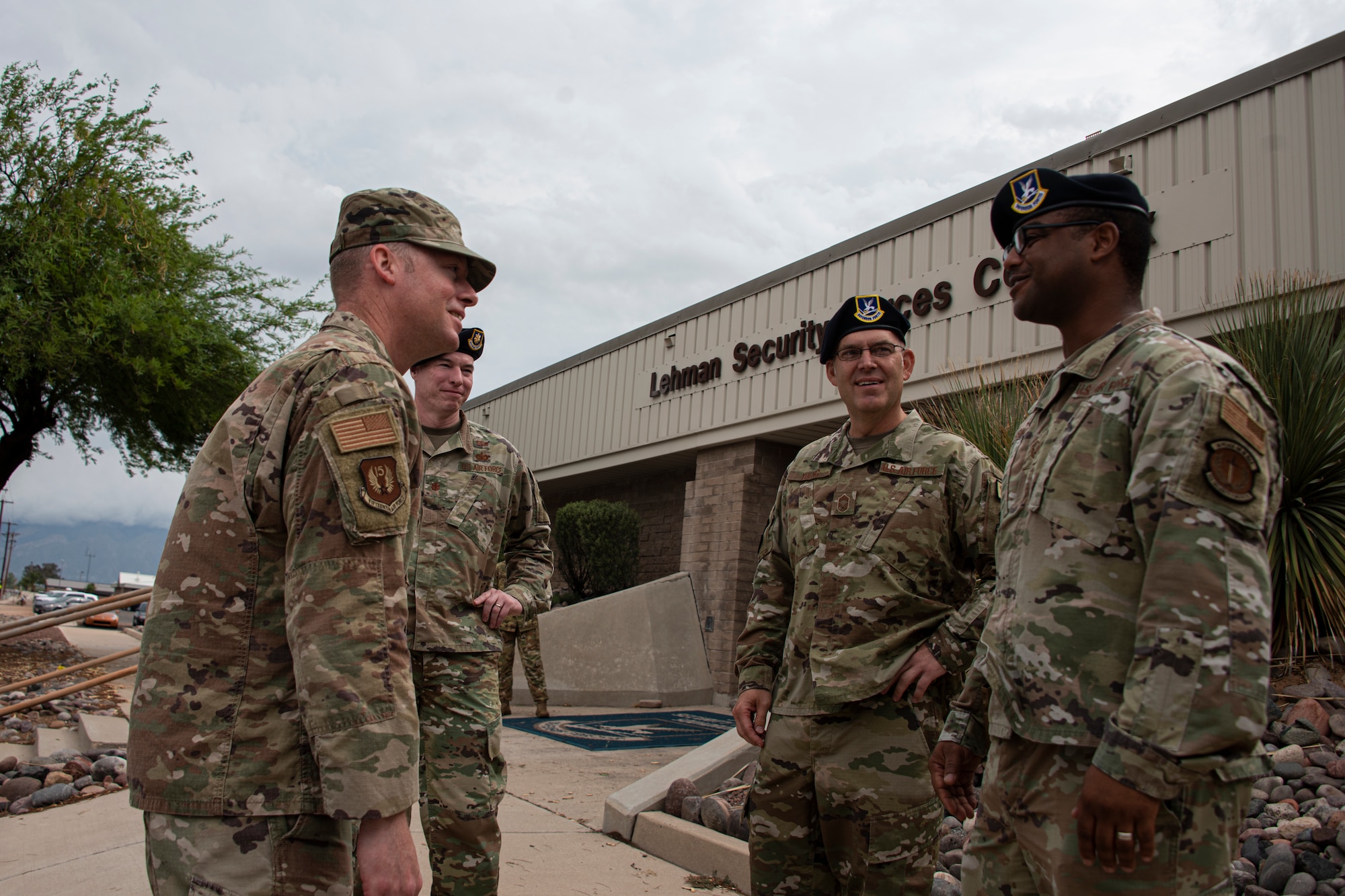 A photo of Airmen outside talking.