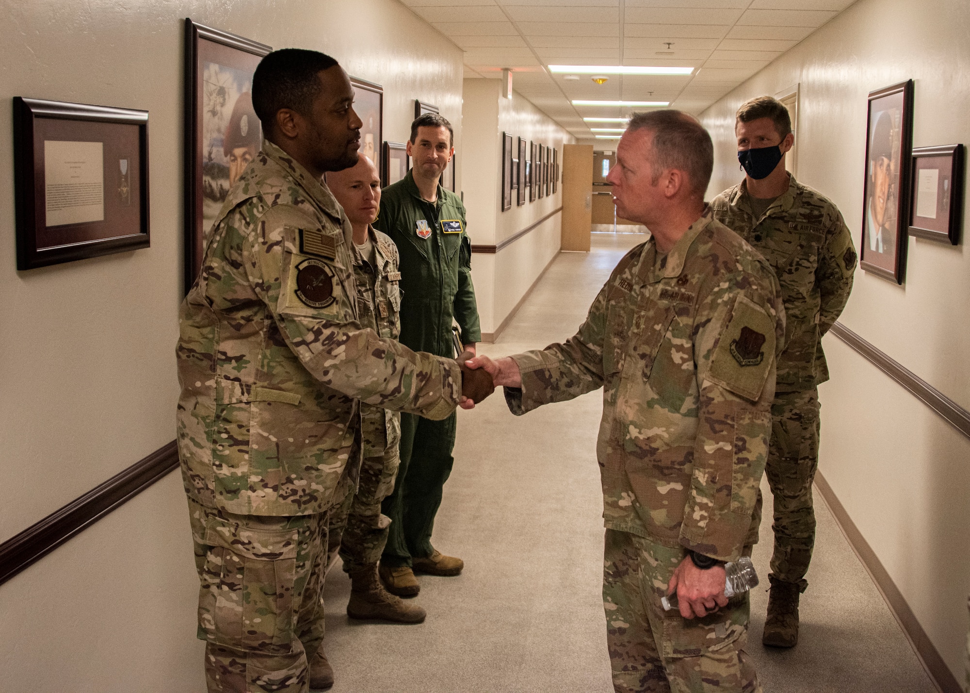 A photo of Airmen shaking hands.