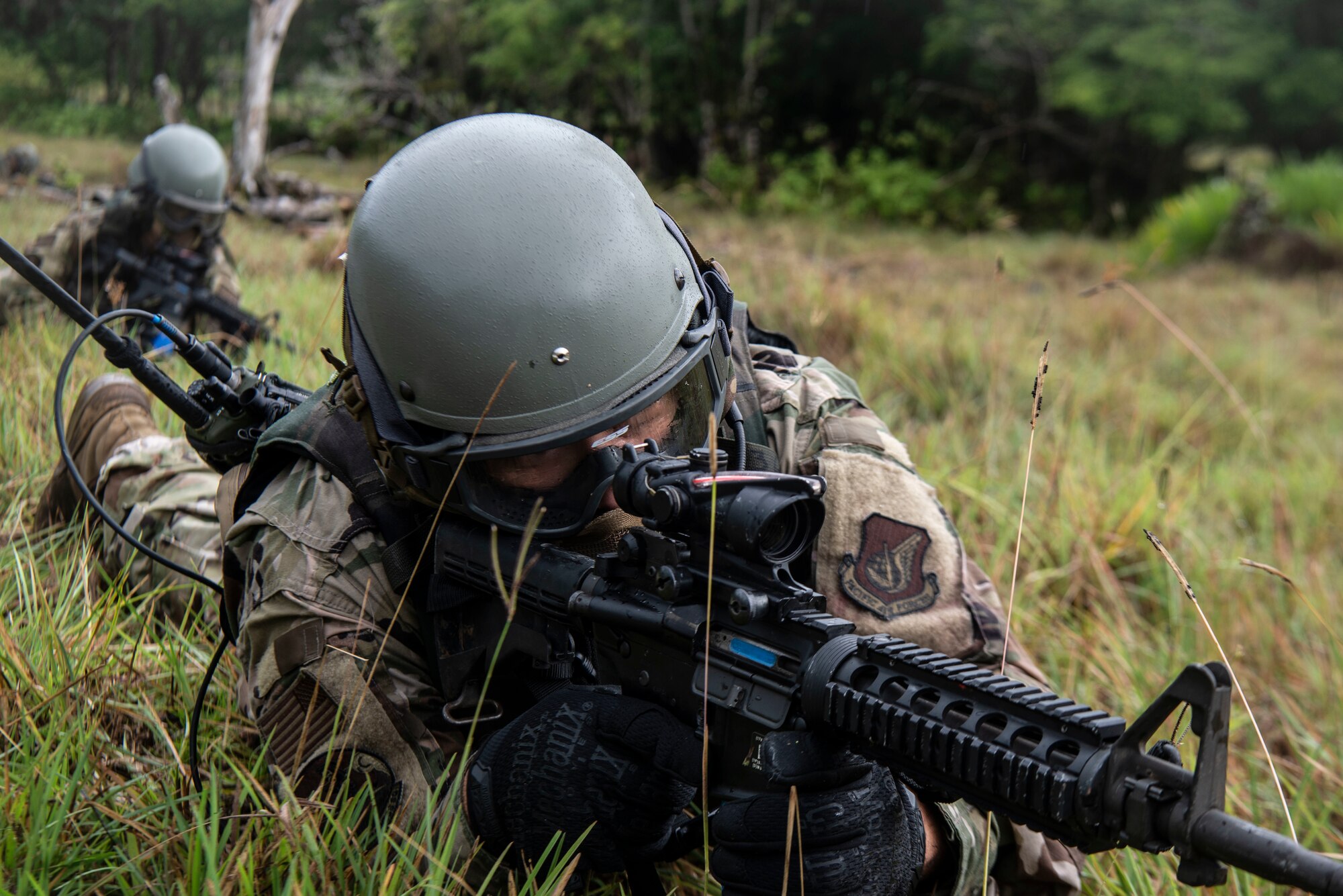 A U.S. Air Force Airman assigned to the 154th Fighter Wing, Hawaii Air National Guard points his weapon downrange during a combat readiness training scenario during Operation Pacific Iron 2021, July 20, 2021, at Andersen Air Force Base, Guam.