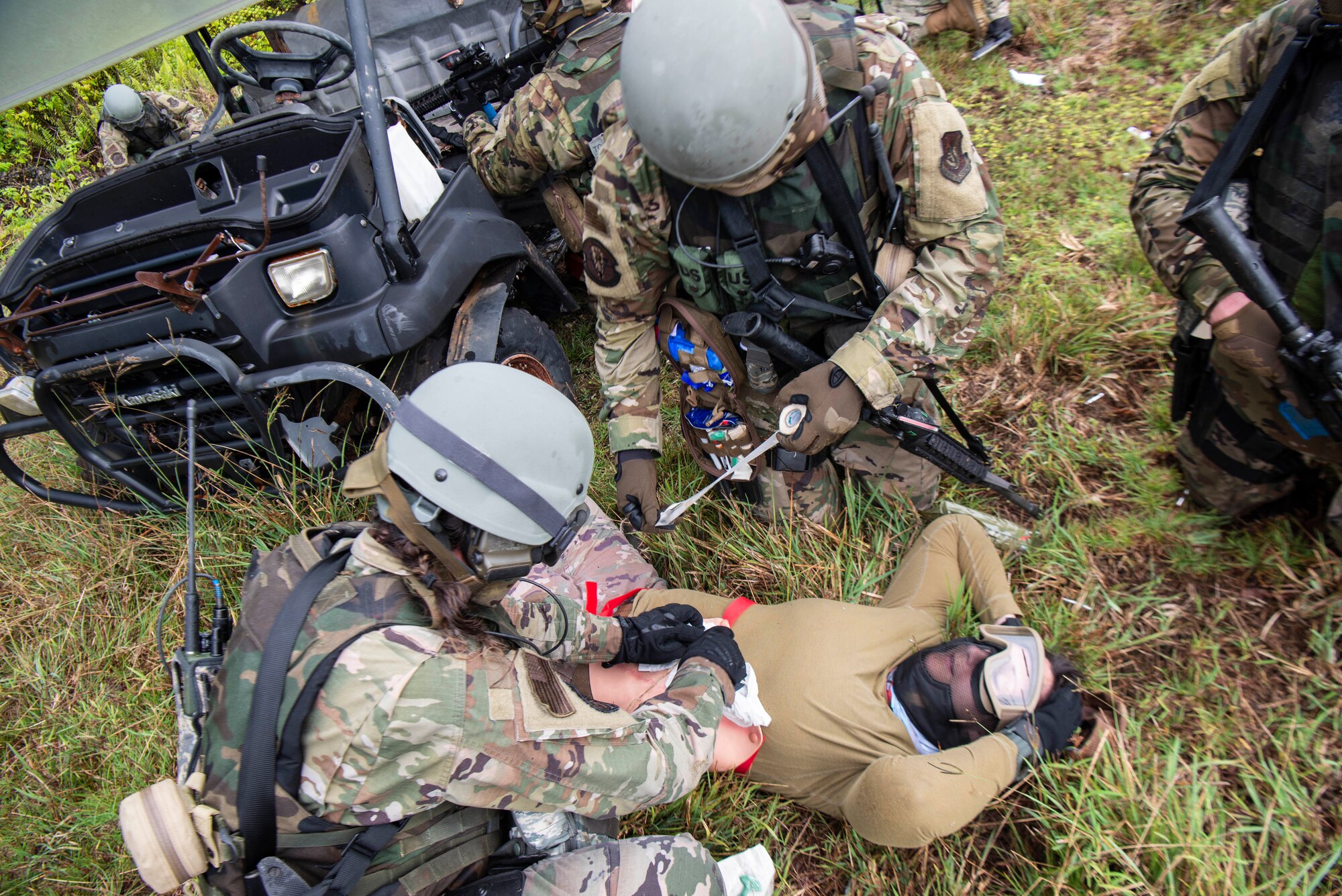 U.S. Air Force Airmen assigned to the 154th Fighter Wing, Hawaii Air National Guard perform simulated emergency field medical procedures during a combat readiness training course during Operation Pacific Iron 2021, July 20, 2021, at Andersen Air Force Base, Guam.