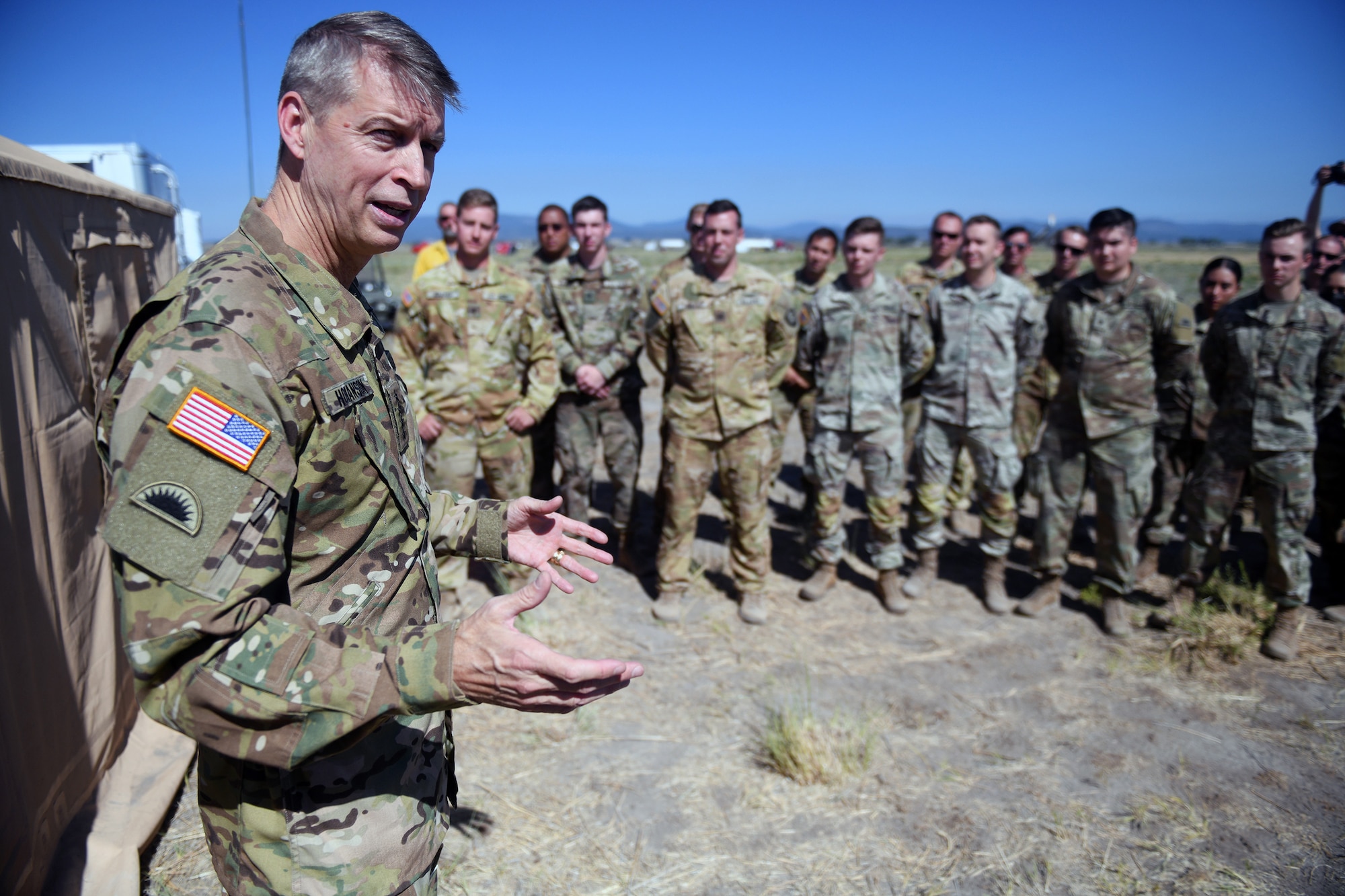 Army Gen. Daniel Hokanson, chief, National Guard Bureau, thanks National Guard members for their ongoing support to local, state and federal agencies fighting the Bootleg Fire, Lakeview, Oregon, July 22, 2021.