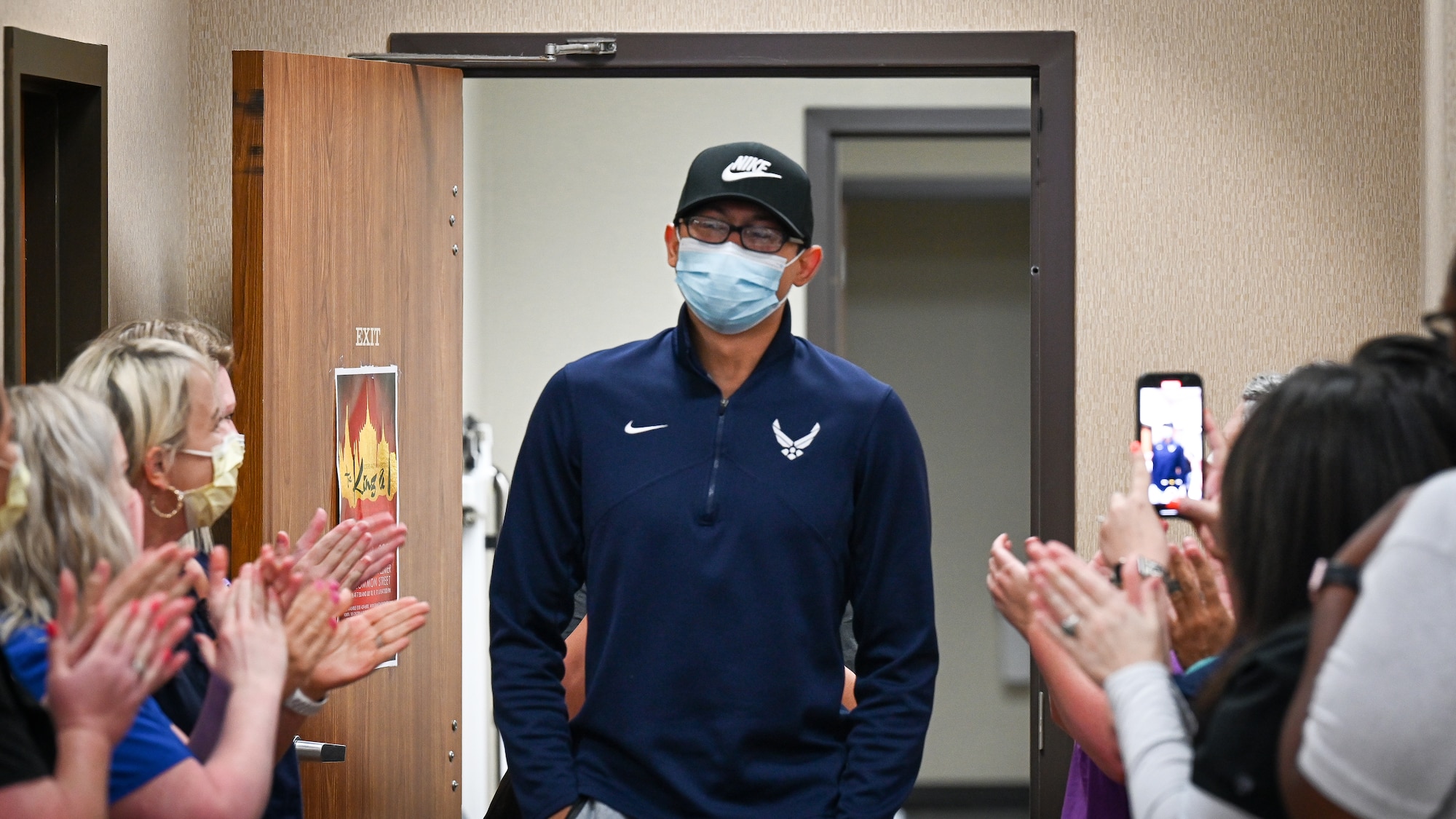 Senior Airman Eleazar Hernandez, 2nd Maintenance Squadron aerospace ground equipment journeyman, is applauded by medical professionals after his final chemotherapy treatment at the CHRISTUS Health Shreveport-Bossier medical center, Louisiana, July 2, 2021. Hernandez had Hodgkin’s lymphoma, a cancer of the lymphatic system and part of the immune system. (U.S. Air Force photo by Airman 1st Class Jonathan E. Ramos)