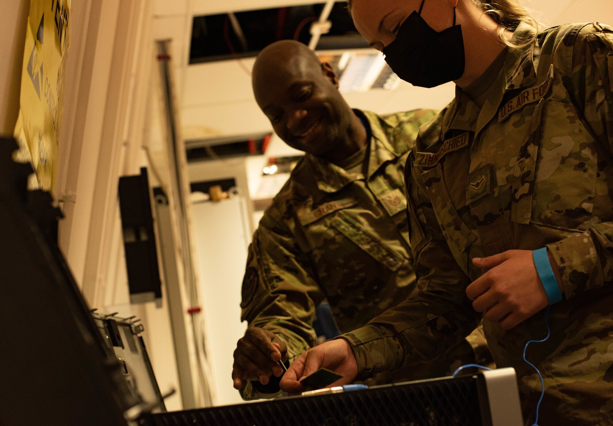 Airmen add storage to workstation