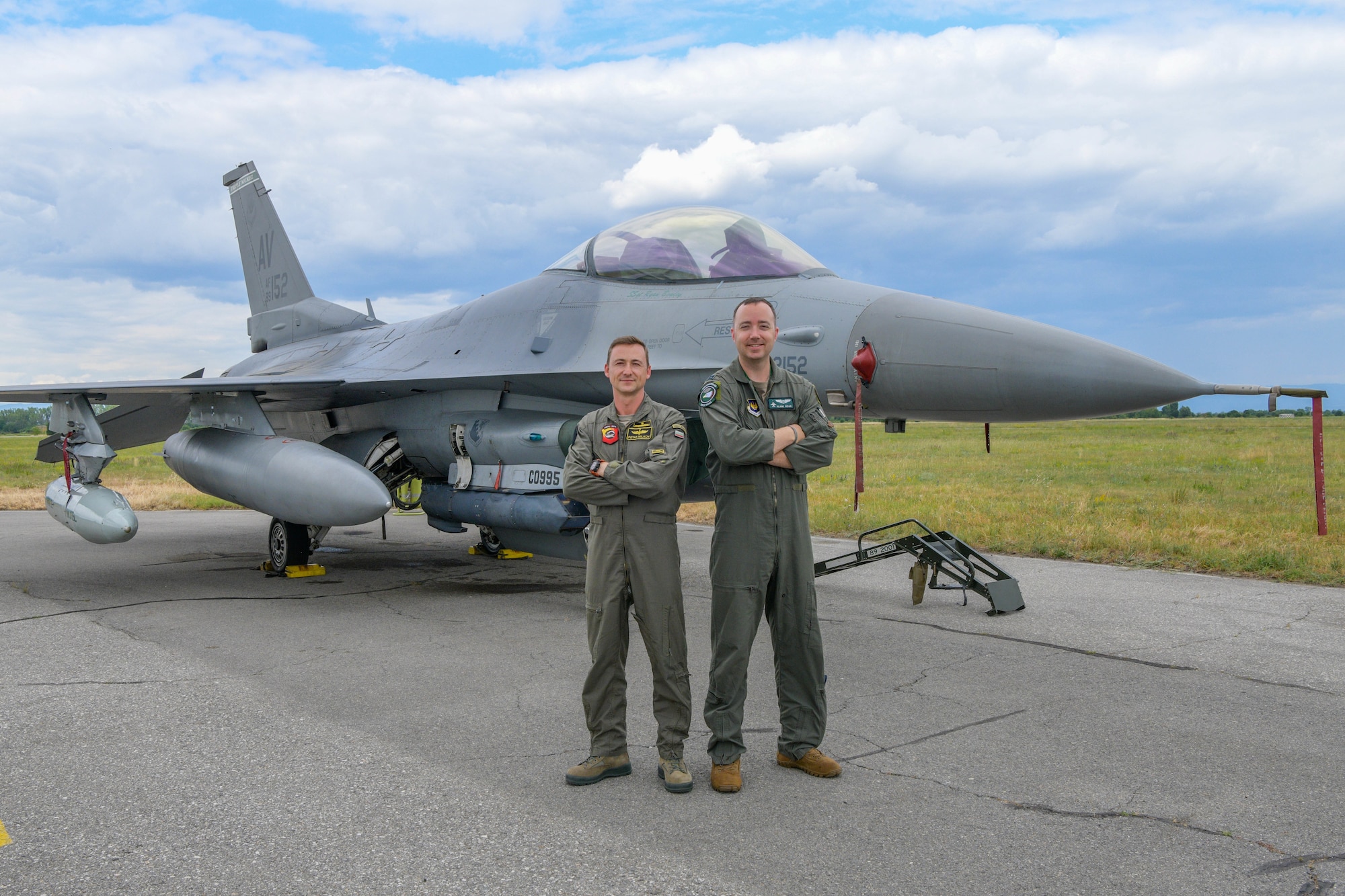 U.S. Air Force Capt. Justin Goar, 555th Fighter Squadron F-16 Fighting Falcon pilot, left, and Bulgarian air force Maj. Petar Milkov, L-39 Albatros instructor, pose for a photo during exercise Thracian Star 21 at Graf Ingatievo Air Base, Bulgaria, July 22, 2021. Thracian Star 21 is a multilateral training exercise with the Bulgarian air force that increases operational capacity, capability and interoperability with Bulgaria. (U.S. Air Force photo by Airman 1st Class Brooke Moeder)