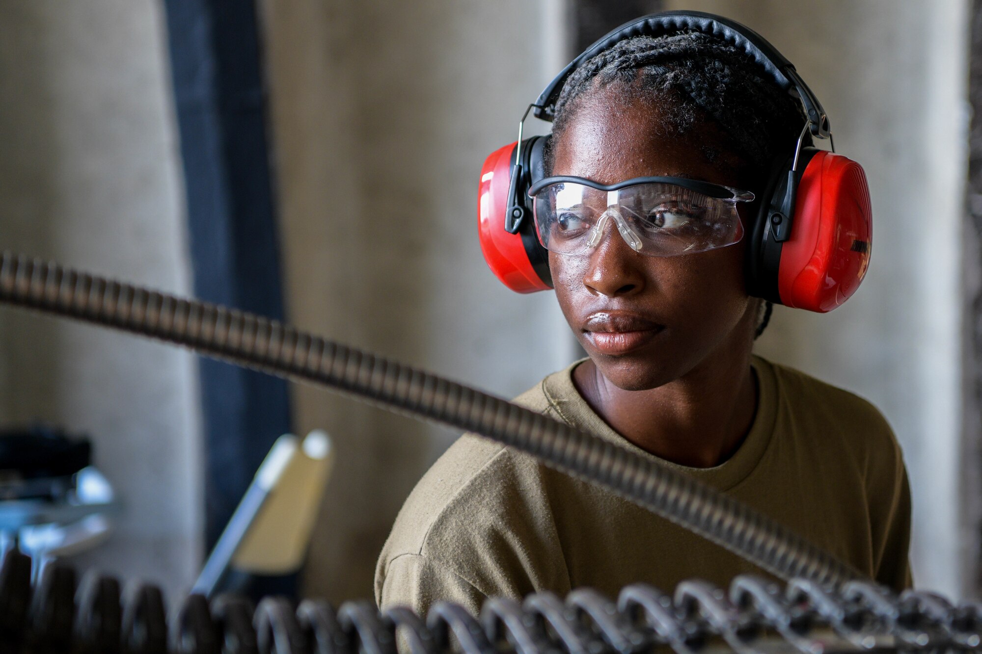 Airman 1st Class Allexis Roberts, 31st Munitions Squadron conventional maintenance crew member, unloads ammunition during exercise Thracian Star 21 at Graf Ignatievo Air Base, Bulgaria, July 20, 2021. During TS21, a Bulgarian air force-led exercise, eight U.S. Air Force F-16 Fighting Falcons assigned to the 555th Fighter Squadron dropped 27 inert training munitions, 180 rockets and approximately 7,000 rounds of 20 MM ammunition at a Bulgarian range. (U.S. Air Force photo by Airman 1st Class Brooke Moeder)