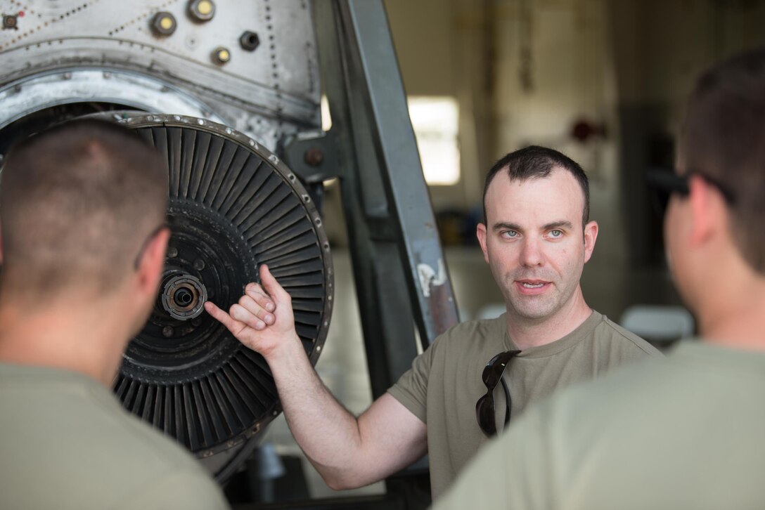 Tech. Sgt. Alex Pinkerton, an aerospace propulsion craftsman from the Kentucky Air National Guard’s 123rd Maintenance Squadron, trains Airmen from the 123rd Airlift Wing on the maintenance and repair of C-130 Hercules aircraft engines at Muñiz Air National Guard Base in Carolina, Puerto Rico, on June 14, 2021, as part of Maintenance University. More than 130 Airmen from the Kentucky Air Guard trained on career-specific proficiencies during the intensive week-long course. (U.S. Air National Guard photo by Phil Speck)