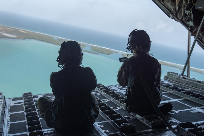 Airmen from the Kentucky Air National Guard’s Public Affairs Office capture photos and video during a familiarization flight aboard a 123rd Airlift Wing C-130 Hercules over Puerto Rico on June 14, 2021, as part of Maintenance University. More than 150 Airmen from the Kentucky Air Guard trained on career-specific proficiencies during the intensive week-long course. (U.S. Air National Guard photo by Phil Speck)