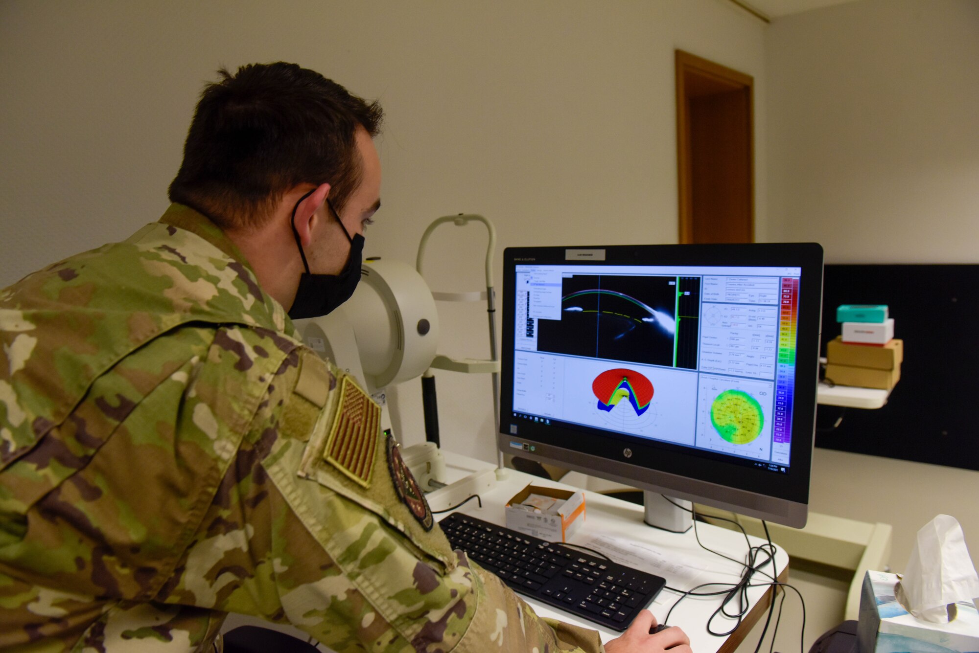 Senior Airman Alexander Peterson, 86th Medical Group human performance and ophthalmic technician, looks at demonstration scans at the optometry clinic.