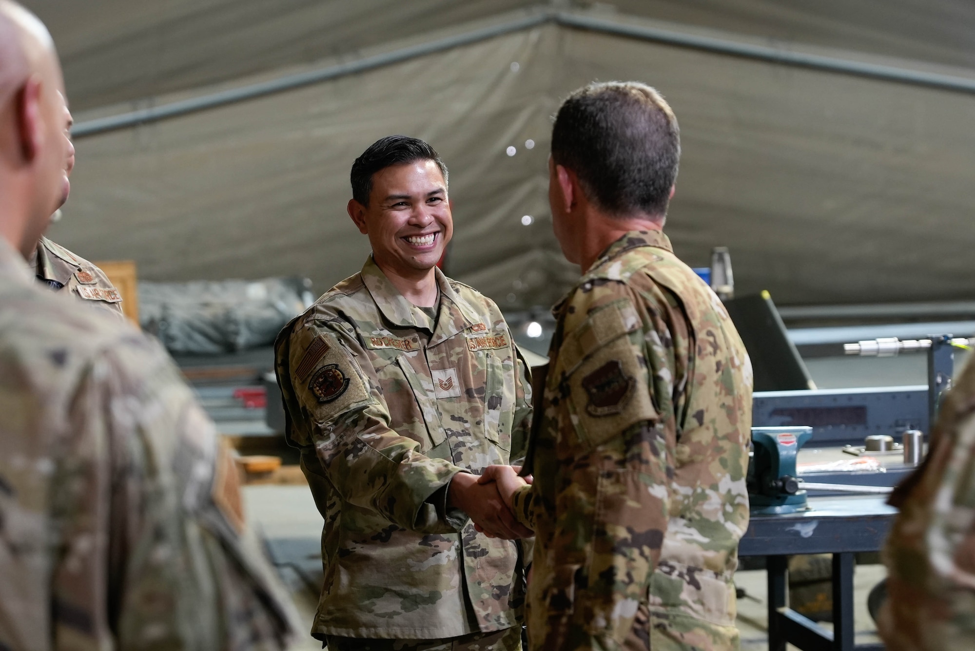 Two U.S. Airmen shake hands