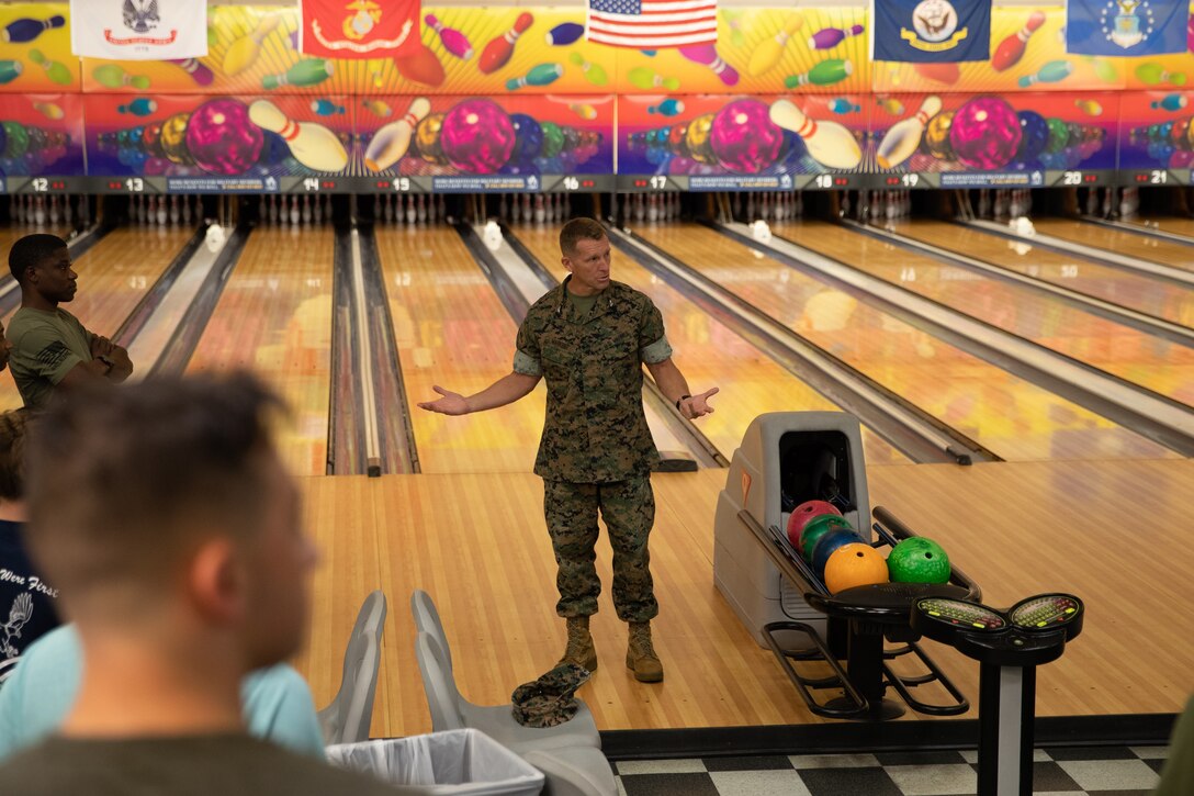 U.S. Marines Col. George Markert, Chief of Staff, 2nd Marine Logistics (2nd MLG) explains the rules before the start of the Commander’s Cup bowling tournament on Camp Lejeune, North Carolina, July 20, 2021.  Combat Logistics Regiment 2 held the event to promote friendly competition and camaraderie. (U.S. Marine Corps photo by Lance Cpl. Zachary Zephir)