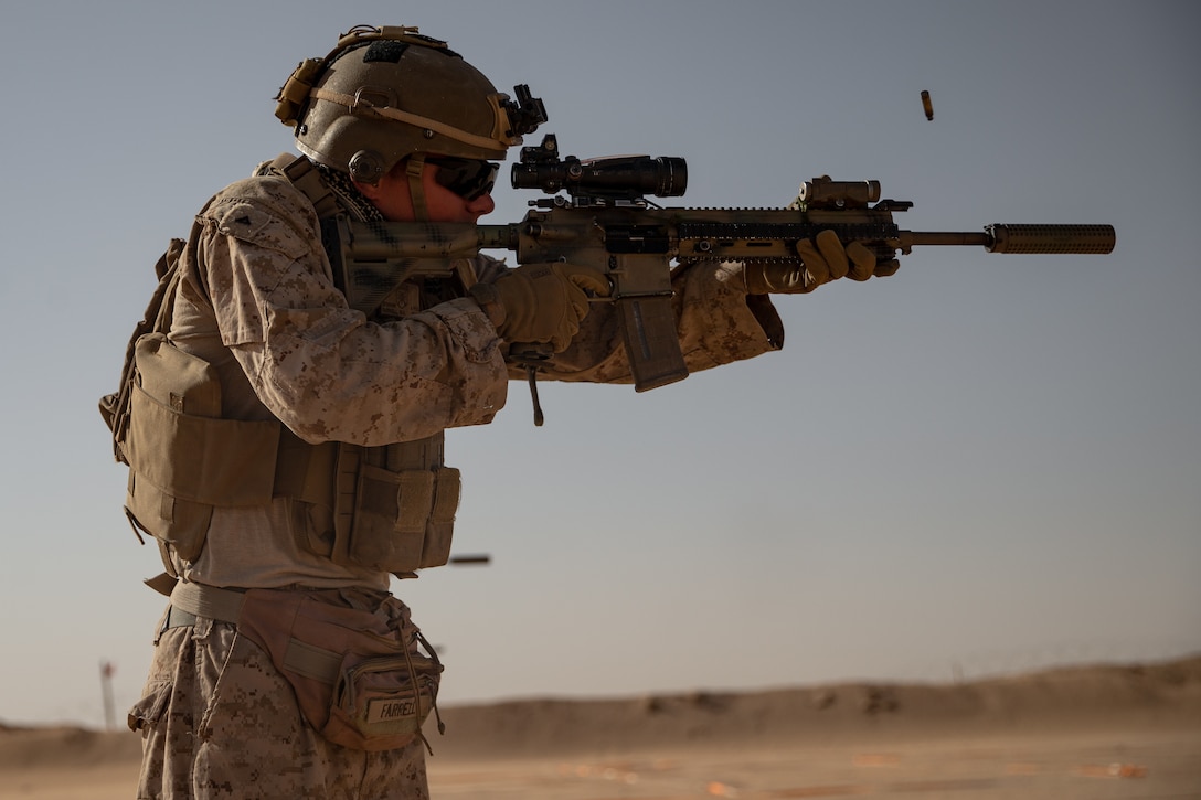 A U.S. Marine, with 2nd Battalion, 1st Marine Regiment, assigned to Special Purpose Marine Air-Ground Task Force – Crisis Response – Central Command (SPMAGTF-CR-CC), fires an M4 service rifle at a target during a Combat Marksmanship Program (CMP) range in the Kingdom of Saudi Arabia, June 11, 2021. The CMP range allows Marines to maintain rifle proficiency by engaging targets at various distances. The SPMAGTF-CR-CC is a crisis response force, prepared to deploy a variety of capabilities across the region. (U.S. Marine Corps photo by Lance Cpl. Willow Marshall)