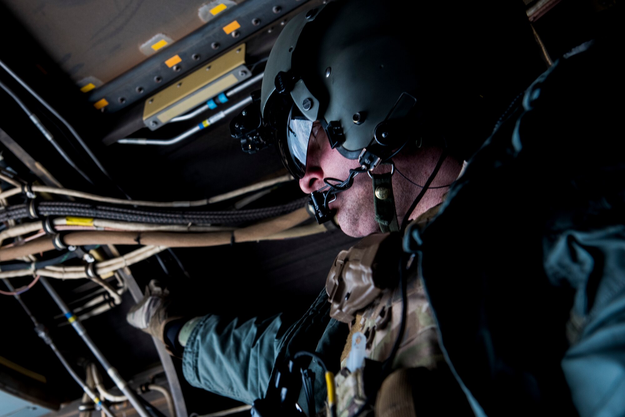 An Airman assigned to the 27th Special Operations Mission Support Team looks out of the rear of a CV-22B Osprey Aircraft during a 27th Special Operations Wing operational readiness exercise at Dugway Proving Grounds, Utah, March 22, 2021. The Mission Support Team concept provides a way forward in building small, scattered teams capable of operating independent of main operating bases. (U.S. Air Force photo by Senior Airman Vernon R. Walter III)