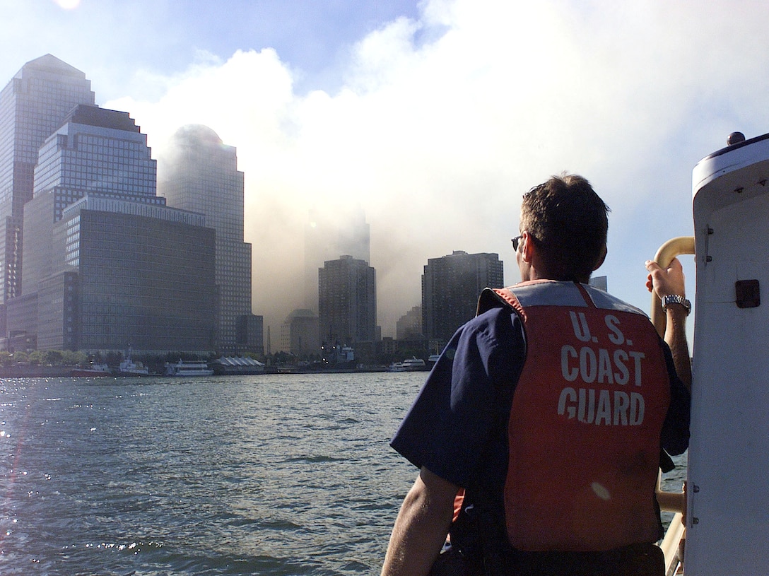 Coast Guard crewmembers patrol the harbor after the collapse of the World Trade Center.  Terrorist hijacked four commercial jets and then crashed them into the World Trade Center in New York, the Pentagon and the Pennsylvania countryside.  USCG photo by PA2 Tom Sperduto