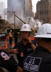 embers of the U.S. Coast Guard Atlantic Strike Team, from Fort Dix, N.J., continue to monitor air quality and coordinate equipment and personnel wash-downs amid the rubble of the Sept., 11 World Trade Center attack in New York City.
