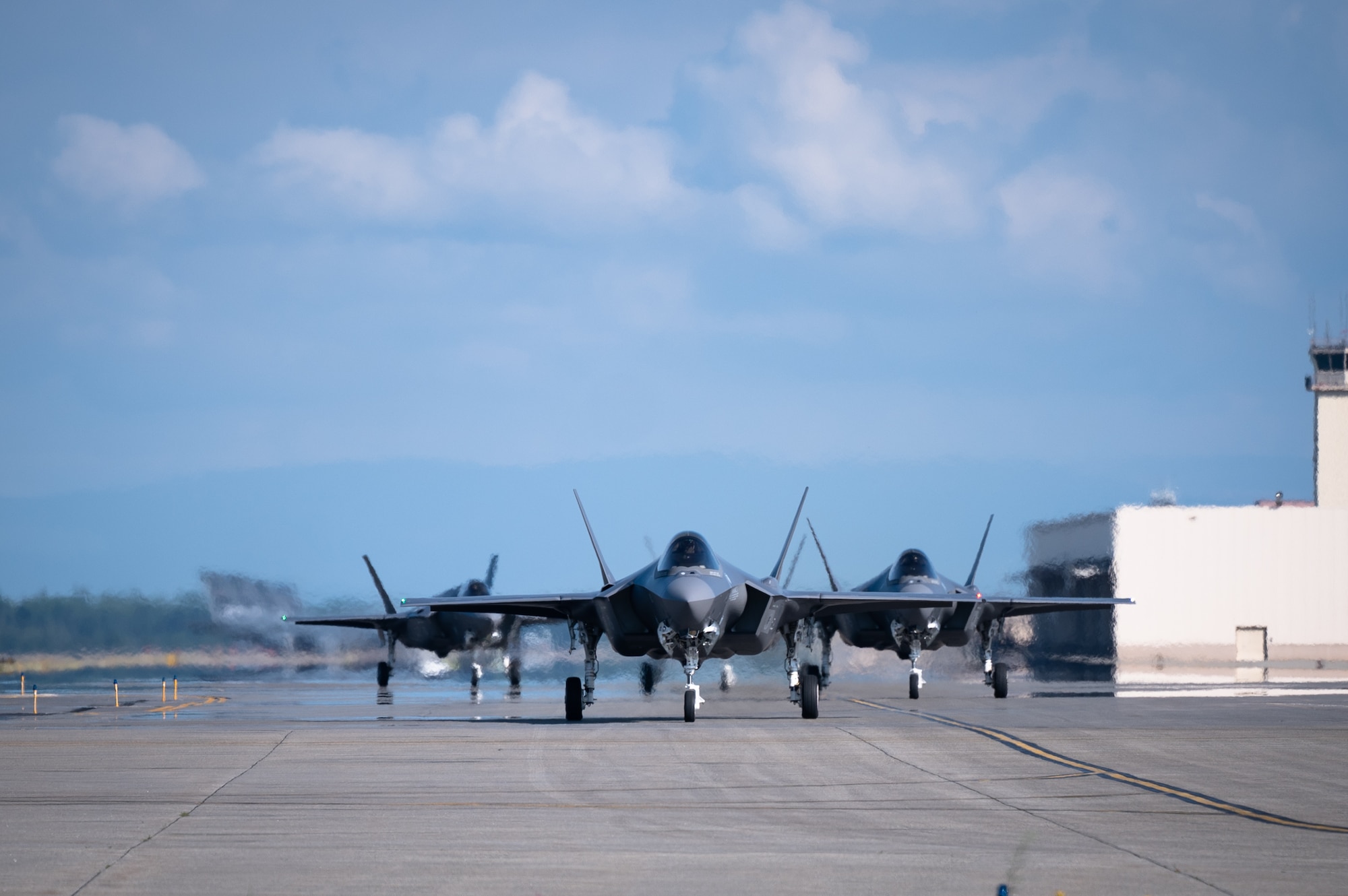 Multiple F-35A Lightning II aircraft assigned to the 354th Fighter Wing taxis on the runway during an Agile Combat Employment (ACE) exercise on Eielson Air Force Base, Alaska, July 15, 2021. The 354th FW applied ACE concepts to become more agile in mission execution, strategic deterrence, and more capable in generating an increased number of sorties with a minimal footprint from a simulated austere environment. (U.S. Air Force photo by Airman 1st Class Jose Miguel T. Tamondong)