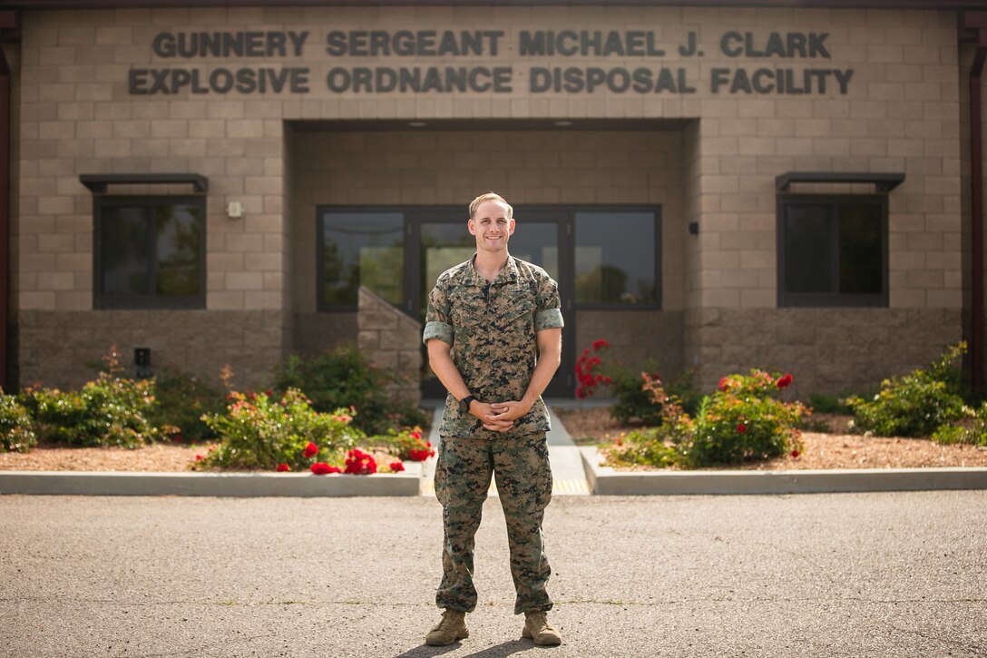 U.S. Marine Corps SSgt. Paul J. Butcher, Explosive Ordnance Disposal Technician, 7th Engineer Support Battalion, 1st Marine Logistics Group, I Marine Expeditionary Force poses for a photo in front of the Explosive Ordnance Disposal facility on Marine Corps Base Camp Pendleton, July 12, 2021. Butcher, Explosive Ordnance Disposal Technician, received the 2021 Marine Corps Engineer Association Explosive Ordnance Disposal Technician of the Year Award for his aggressive initiative and aptitude as an Explosive Ordnance Disposal Technician as well as a Staff Noncommissioned officer. (U.S. Marine Corps Photo by Sgt. Maximiliano Rosas)