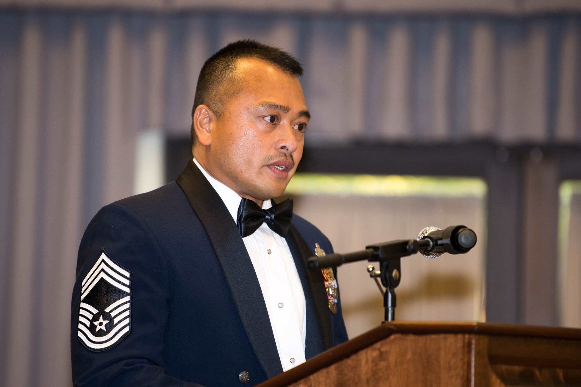 Chief Master Sgt. Darwin Mallari, 436th Force Support Squadron superintendent, speaks during the Staff Sgt. Julio Alonso Airman Leadership School, Class 21-F, dinner and graduation ceremony held at The Landings on Dover Air Force Base, Delaware, July 22, 2021. Mallari commented on seeing smiling faces in person, and not virtually, to celebrate the accomplishments of our newest Air Force supervisors. (U.S. Air Force photo by Mauricio Campino)