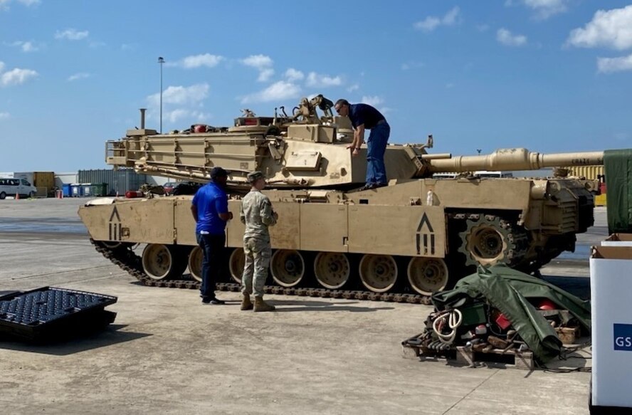 Richard Wills, a U.S. Army Tank-automotive and Armaments Command Logistics Assistance Representative assigned to Army Field Support Battalion-Germany, 405th Army Field Support Brigade, and Maj. Mitchell Brooks, the Support Operations officer for AFSBn-Germany, 405th AFSB, assist a Soldier from 1st Brigade, 1st Cavalry Division with the turn-in of a M1A2 Abrams tank. Small teams of 2-3 persons from AFSBn-Germany worked with 1st Bde., 1st Cav. Div. in Germany, Greece and Lithuania following U.S. Army Europe and Africa’s DEFENDER-Europe 21 exercise to turn in 58 M1A2 tanks and four M104 Wolverine heavy assault bridges plus dozens of support items and accessories.