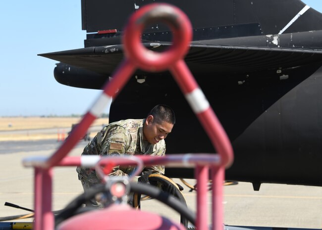 Staff Sgt. Peter John Mandadero, 9th Logistics Readiness Squadron Immediate Response Force team member, prepares fuel hoses for a U-2 Dragon Lady during an exercise to test out the Tactical Aviation Ground Refueling System, July  9, 2021, at Beale Air Force Base, California.