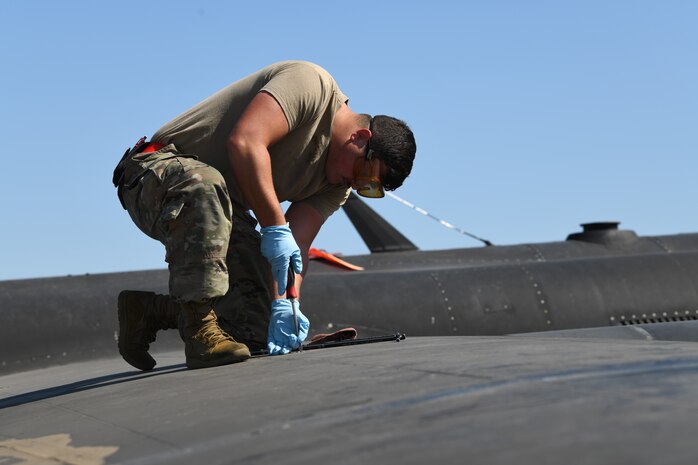 9th Aircraft Maintenance Squadron Immediate Response Force (IRF) team member, unscrews a panel on a U-2 Dragon Lady to check the fuel during an exercise July 9, 2021, at Beale Air Force Base, California.