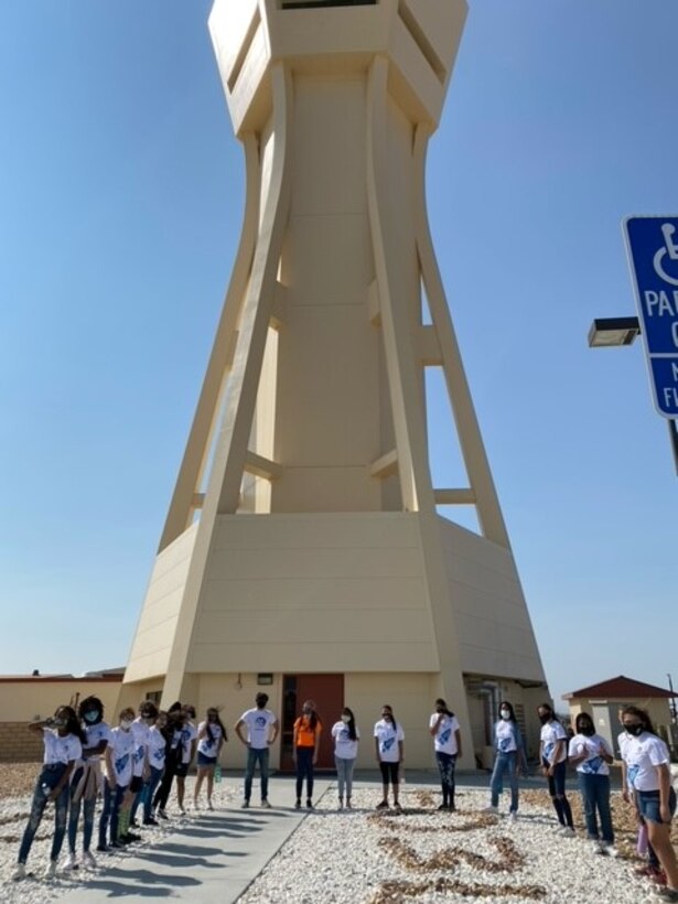 STARBASE Edwards pose for a group photo in front of the air control tower at Edwards Air Force Base, California. (Photo courtesy of STARBASE Edwards)