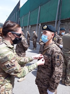 Alaska Army National Guard Capt. Jessica Miller and Sgt. 1st Class Juan Restrepo spend time with their Mongolian counterparts during the last rotation of the Mongolian Expeditionary Task Force liaison program in New Kabul Compound, Afghanistan, December 2020 - July 2021. This program started in 2003 shortly after the country was selected for Alaska’s state partnership program, and finally came to an end in 2021 when the camp was signed over to the Afghan Army, the METF returned to Mongolia, and the Alaska National Guardsmen returned to Alaska. (Courtesy photo)