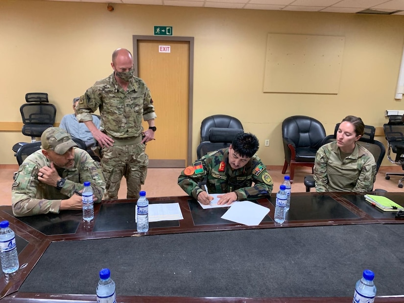 Alaska Army National Guard Capt. Jessica Miller takes part in signing over New Kabul Compound over to the Afghan Army in Afghanistan, May 22, 2021, during her time as a liaison for the Mongolian Expeditionary Task Force. This program started in 2003 shortly after the country was selected for Alaska’s state partnership program, and finally came to an end in 2021 when the camp was signed over to the Afghan Army, the METF returned to Mongolia, and the Alaska National Guardsmen returned to Alaska. (Courtesy photo)