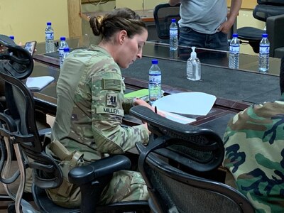 Alaska Army National Guard Capt. Jessica Miller takes part in signing over New Kabul Compound over to the Afghan Army in Afghanistan, May 22, 2021, during her time as a liaison for the Mongolian Expeditionary Task Force. This program started in 2003 shortly after the country was selected for Alaska’s state partnership program, and finally came to an end in 2021 when the camp was signed over to the Afghan Army, the METF returned to Mongolia, and the Alaska National Guardsmen returned to Alaska. (Courtesy photo)