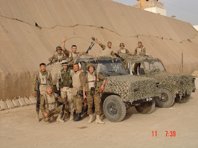 Lt. Col. Steve Wilson poses for a photo with his Mongolian counterparts in Iraq, May 11, 2004. Wilson was the first liaison to accompany the Mongolian Armed Forces on a deployment during the Global War on Terrorism as part of the state partnership program. The SPP is a program that links a state’s National Guard with the armed forces or equivalent of a partner country in a cooperative, mutually beneficial relationship. (Courtesy photo)