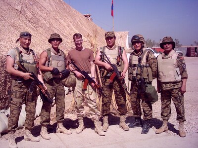 Lt. Col. Steve Wilson poses for a photo with his Mongolian counterparts in Iraq in 2004. Wilson was the first liaison to accompany the Mongolian Armed Forces on a deployment during the Global War on Terrorism as part of the state partnership program. The SPP is a program that links a state’s National Guard with the armed forces or equivalent of a partner country in a cooperative, mutually beneficial relationship. (Courtesy photo)