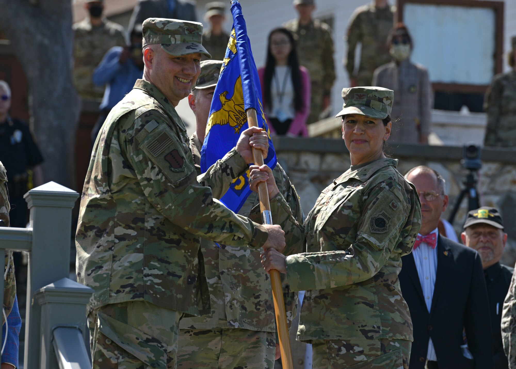 U.S. Air Force Col. Matthew Reilman, 17th Training Wing commander, presents the guidon to 517th Training Group incoming commander, Col. Jennifer Saraceno, during the 517th TRG change of command ceremony at the Presidio of Monterey, California, July 23, 2021. Saraceno was the former Executive Officer to the Director at the Defense Intelligence Agency at the Pentagon in Washington, D.C. (U.S. Air Force photo by Senior Airman Ashley Thrash)