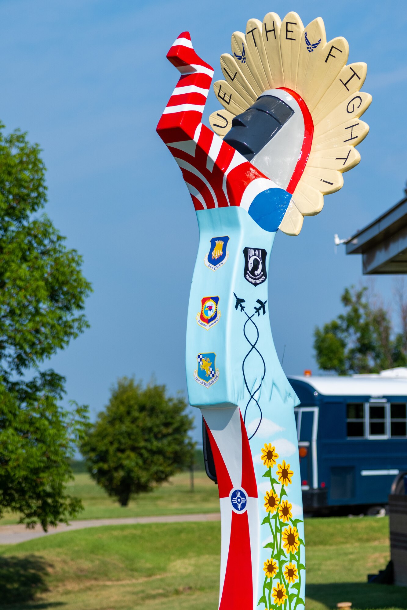 The 52nd Keepers on Parade statue donated to McConnell Air Force Base stands outside of the base visitor center after its unveiling July 23, 2021, at McConnell AFB, Kansas. The ten-foot-tall Keeper of the Plains was donated by the Friends of McConnell organization and designed by Vincent Fredericksen, 22nd Civil Engineer Squadron base architect, and Staff Sgt. Trevor Bjelke, former 22nd Communications Squadron network infrastructure technician. (U.S. Air Force photo by Senior Airman Skyler Combs)