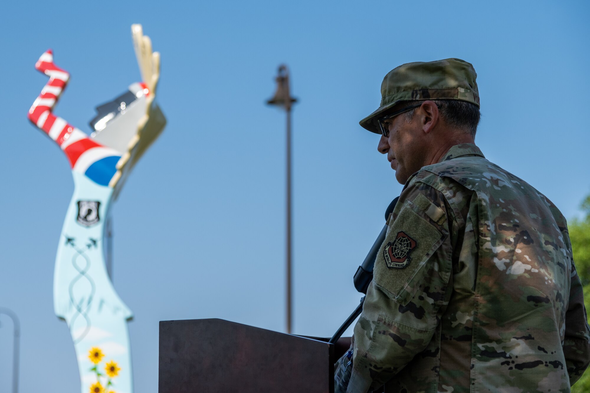 Col. Nate Vogel, 22nd Air Refueling Wing commander, gives a speech at the unveiling of the Keeper of the Plains replica donated to the base July 23, 2021, at McConnell Air Force Base, Kansas. The ten-foot-tall Keeper was donated by the Friends of McConnell organization and designed by Vincent Fredericksen, 22nd Civil Engineer Squadron base architect, and Staff Sgt. Trevor Bjelke, former 22nd Communications Squadron network infrastructure technician. (U.S. Air Force photo by Senior Airman Skyler Combs)